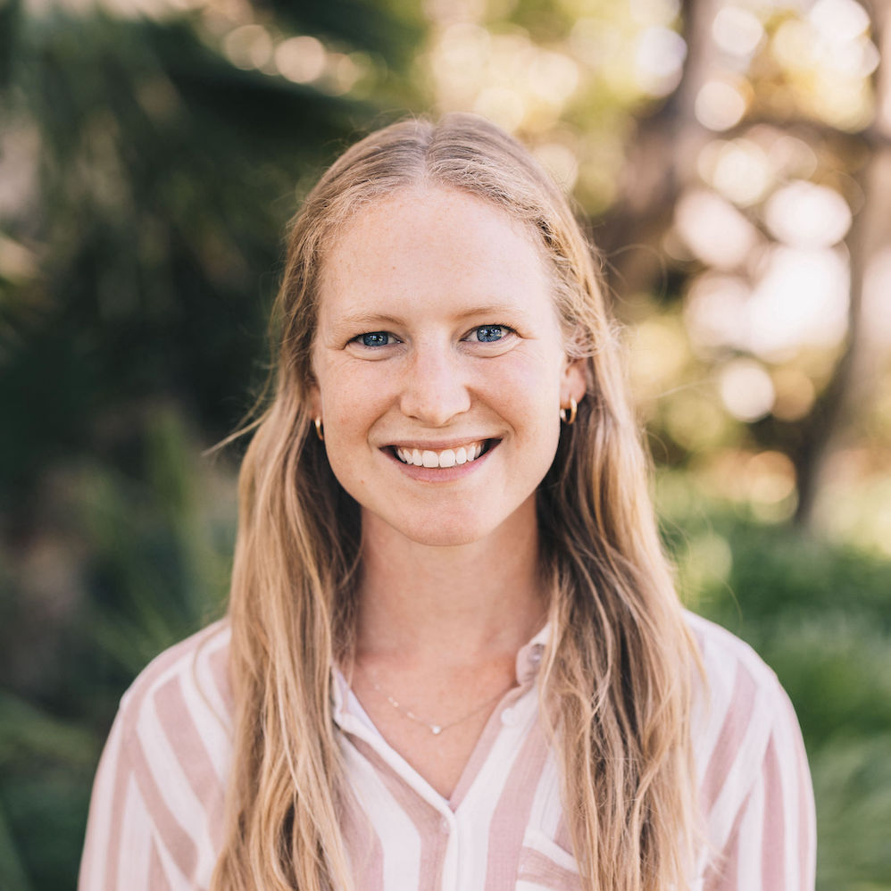 Photograph of a woman smiling.